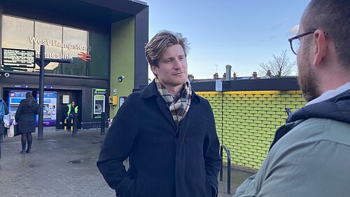 Patrick speaking to resident outside Thameslink Station